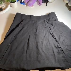 black pleated skirt